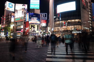 Crowd in city at night