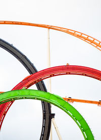 Colorful rollercoaster against clear sky