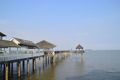 Pier over sea against sky