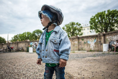 Boy wearing sunglasses against sky