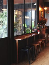 Empty chairs and tables in restaurant