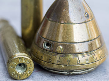 Close-up of old machine part on table