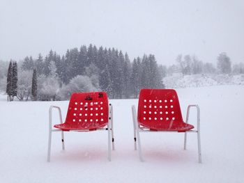 Empty bench in snow