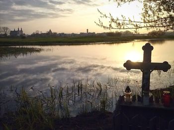 Scenic view of lake against sky during sunset