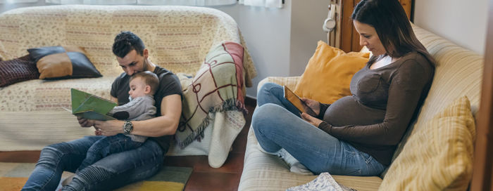 Parents sitting with son at home