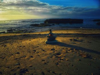 Scenic view of beach against sky