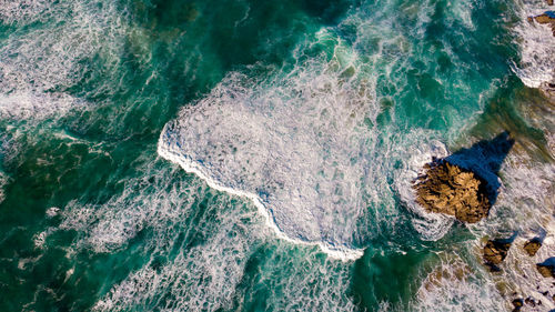 High angle view of rocks on shore