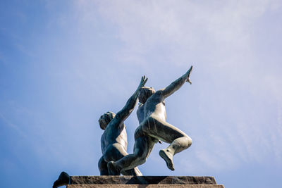 Low angle view of statue against sky