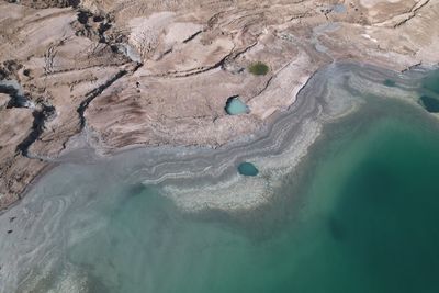 High angle view of rocks in sea