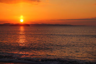 Scenic view of sea at sunset