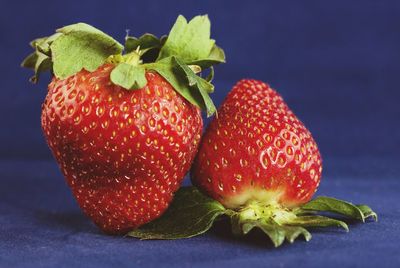 Close-up of strawberries on blue background
