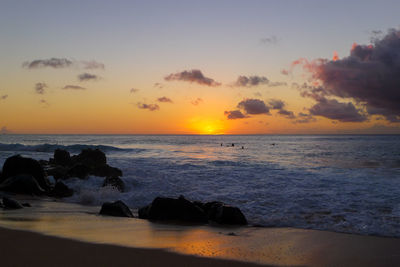 Scenic view of sea against sky during sunset