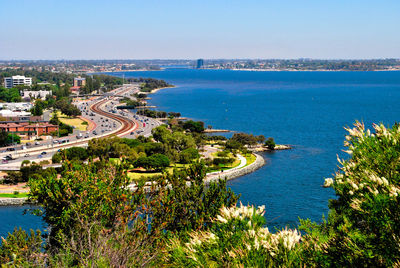 High angle view of bay against clear blue sky