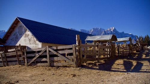 Row of houses against clear blue sky