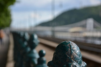 Close-up of metallic bollard on street