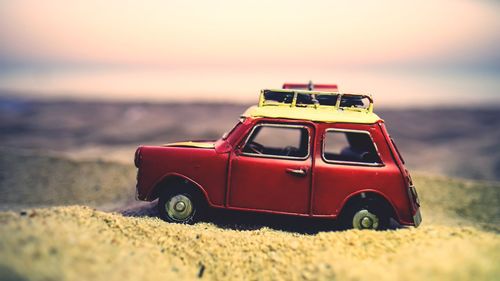 Close-up of toy car on beach