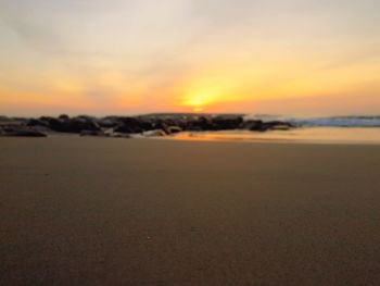 Scenic view of sea against sky at sunset