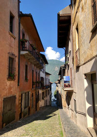 Narrow alley amidst buildings in town