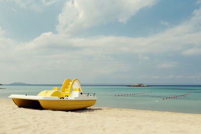 Boat on beach against sky