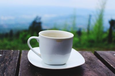 Close-up of coffee cup on table