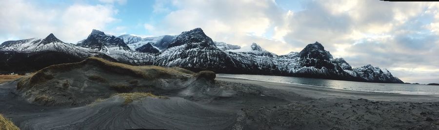 Panoramic view of lake and mountains against sky