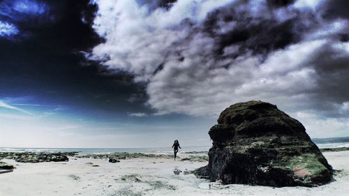 Scenic view of sea against cloudy sky