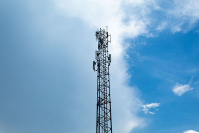 Low angle view of communications tower against sky