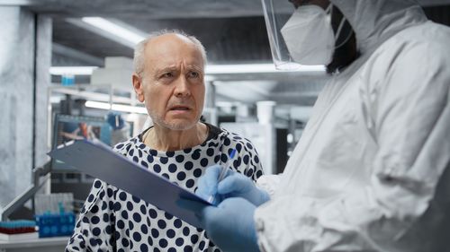 Portrait of man standing in office