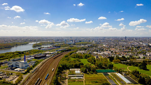 High angle view of city buildings against sky