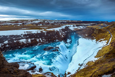 Scenic view of gullfoss falls against sky