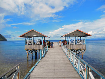 Pier over sea against sky