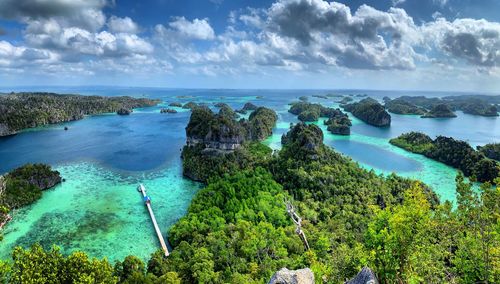 High angle view of bay against trees at puncak harapan misool island raja ampat 