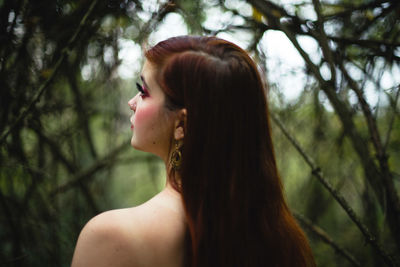 Portrait of a young woman looking away