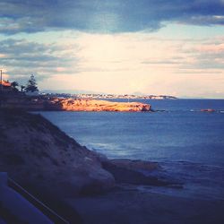 Scenic view of sea against cloudy sky