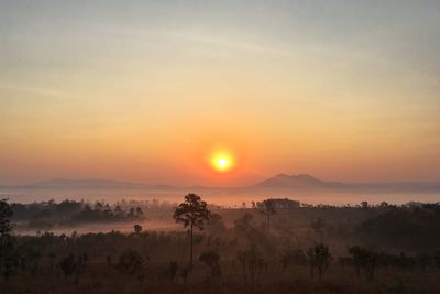Scenic view of landscape against sky during sunset