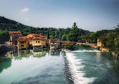 View of buildings by river