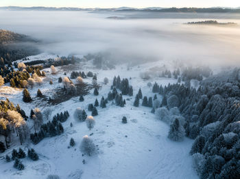 Scenic view of snow covered landscape against sky