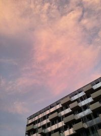 Low angle view of building against sky during sunset