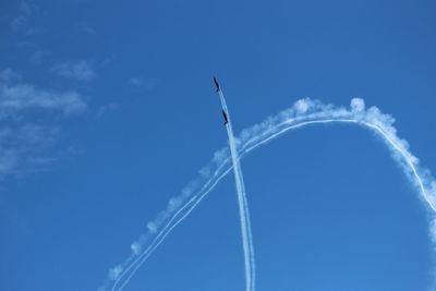 Low angle view of vapor trail against sky