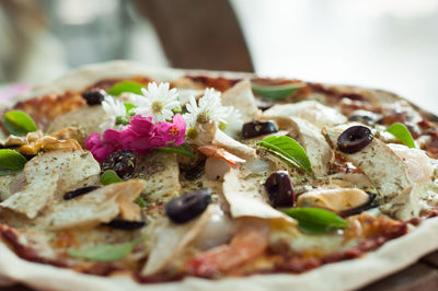 Close-up of pizza in plate on table