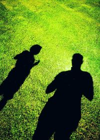 Shadow of man on field