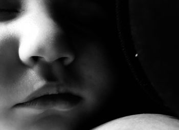 Close-up portrait of woman with eyes closed