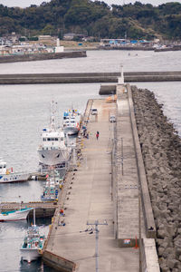 Boats moored at harbor