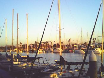 Boats moored at harbor