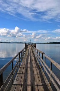 Pier over sea against sky