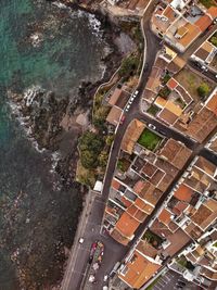 High angle view of road amidst buildings in city