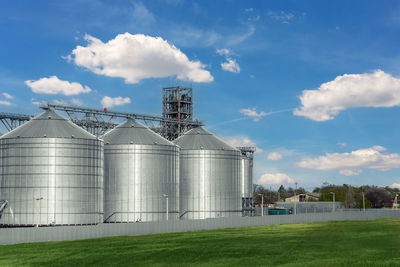 Built structure on field against sky