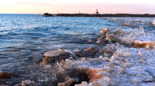 Scenic view of sea against sky during sunset
