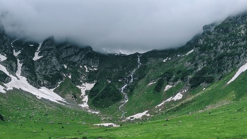 Scenic view of mountains against sky during winter