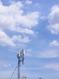 Low angle view of communications tower against sky